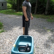 Instructor Eric carting Kettlebells down to the Beach for a Beach Kettlebell Workout at Long Sands Beach, Maine in August 2011.